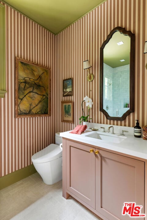 bathroom with vanity and toilet