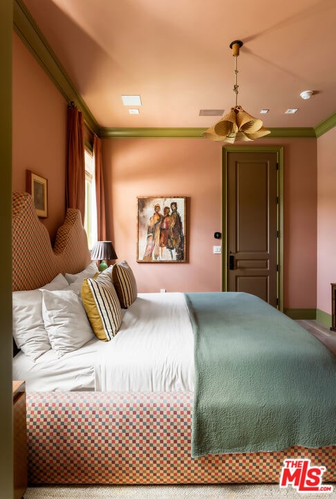 bedroom featuring ornamental molding and ceiling fan