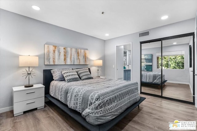 bedroom featuring wood-type flooring