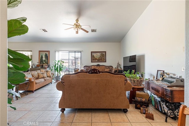 tiled living room featuring ceiling fan