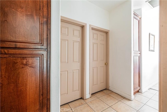 hallway with light tile patterned floors