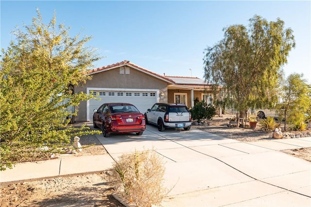 ranch-style house with a garage and solar panels