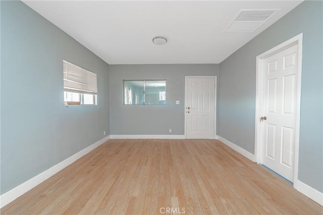 spare room with light wood-type flooring