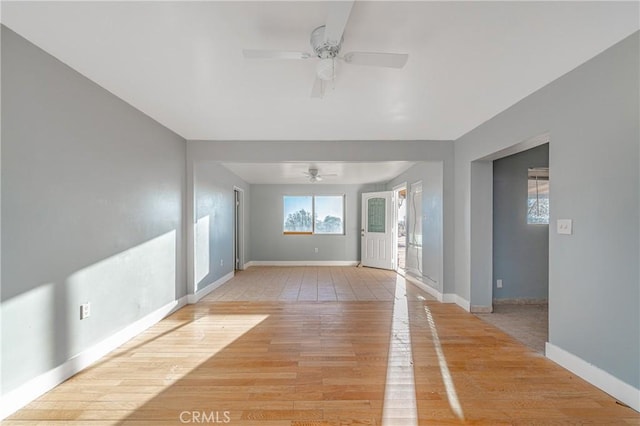 spare room with light hardwood / wood-style floors and ceiling fan