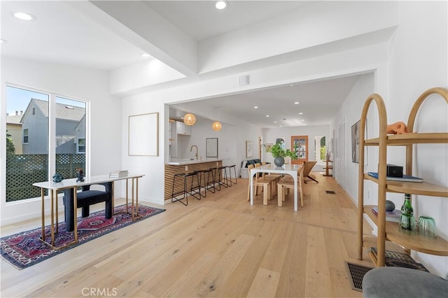 dining room featuring light hardwood / wood-style floors and sink