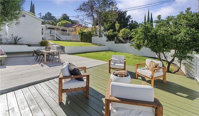 wooden deck featuring a lawn and an outdoor living space