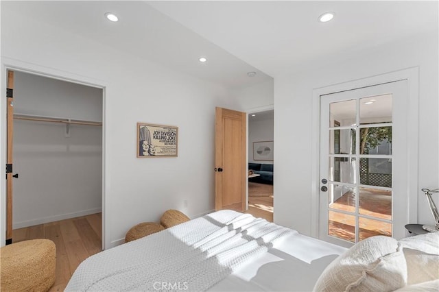 bedroom featuring hardwood / wood-style flooring and a closet