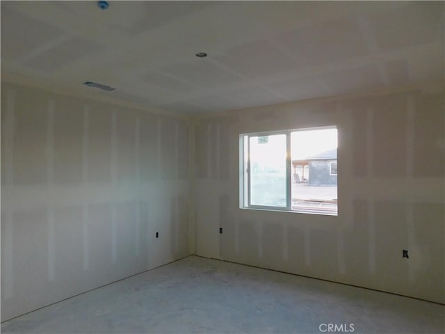 unfurnished room featuring concrete floors