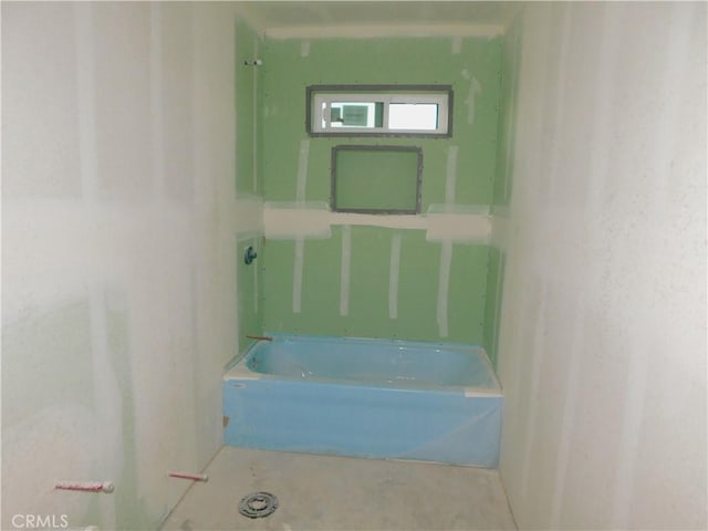 bathroom featuring a tub to relax in