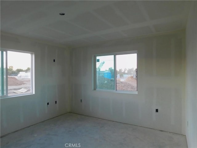 spare room with concrete floors