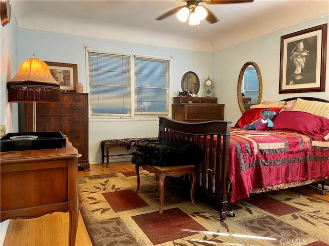 bedroom with ceiling fan and light hardwood / wood-style floors