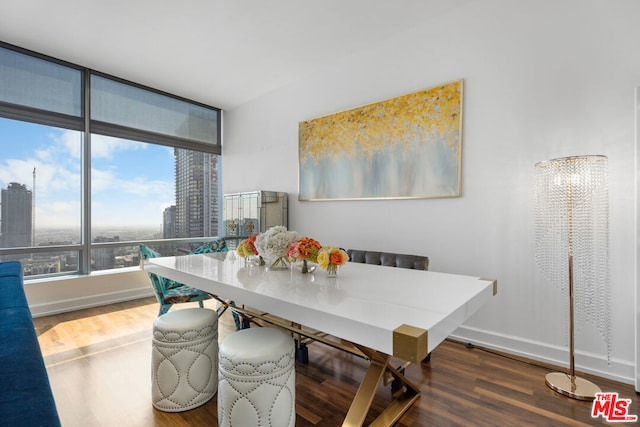 dining area with hardwood / wood-style flooring