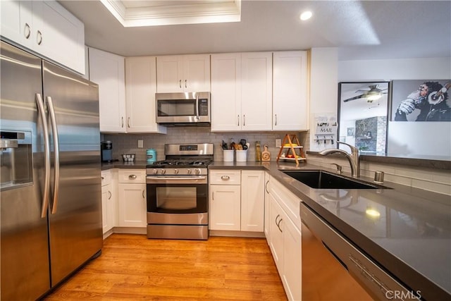 kitchen featuring white cabinets, sink, and stainless steel appliances