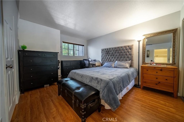 bedroom featuring hardwood / wood-style floors