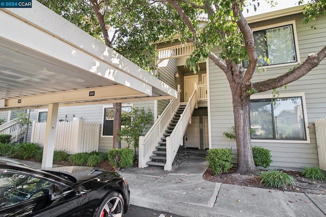 property entrance with a carport