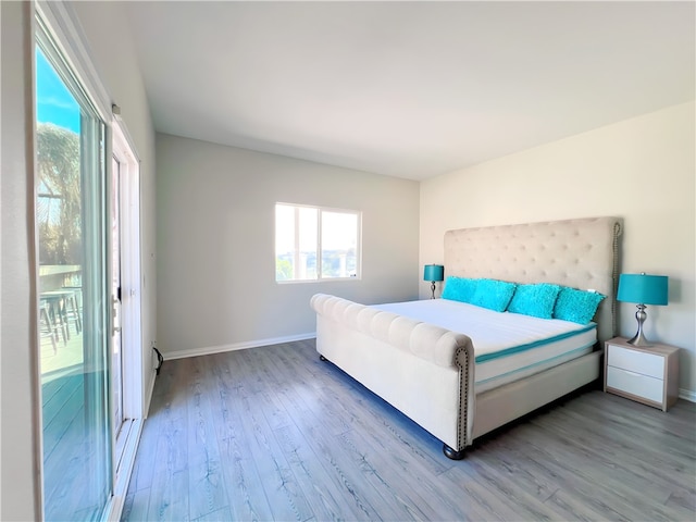 bedroom with wood-type flooring