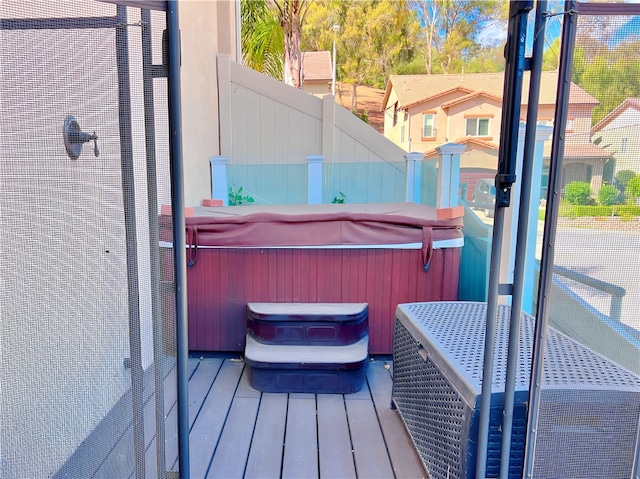 exterior space with a hot tub