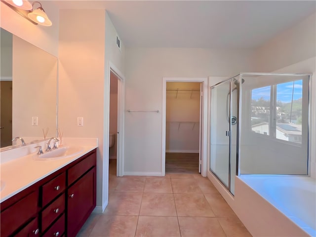 full bathroom with separate shower and tub, tile patterned floors, vanity, and toilet