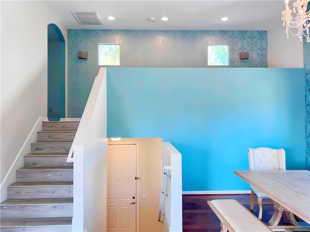 staircase featuring hardwood / wood-style floors