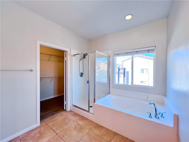 bathroom featuring tile patterned flooring and plus walk in shower