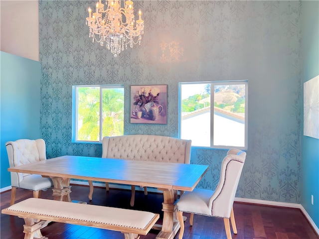 dining area with a chandelier and wood-type flooring