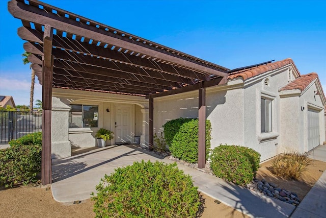 exterior space with a pergola and a garage