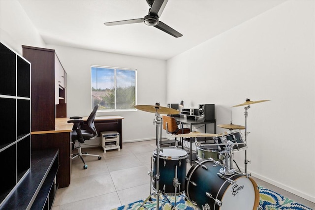 office space with ceiling fan and light tile patterned floors