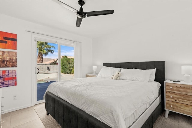 bedroom featuring ceiling fan, light tile patterned flooring, and access to outside