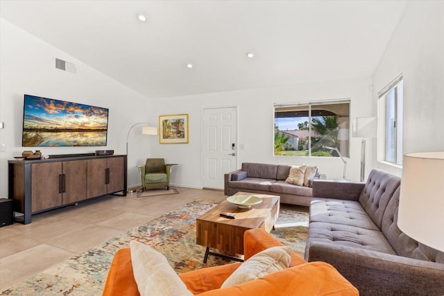 tiled living room with lofted ceiling