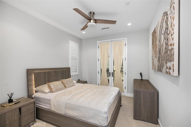 bedroom featuring ceiling fan and light colored carpet