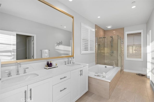 bathroom with tile patterned floors, vanity, and separate shower and tub