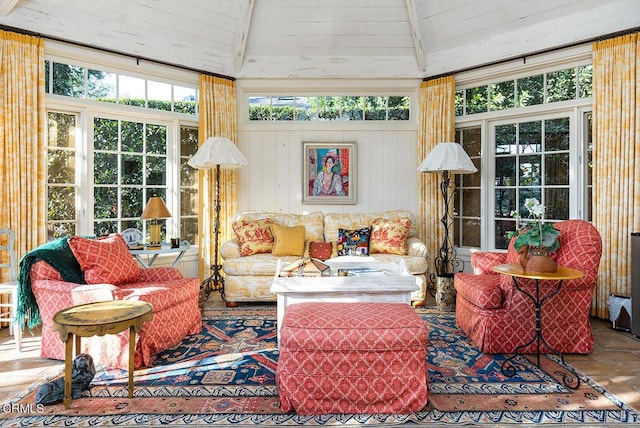 sunroom / solarium featuring lofted ceiling with beams and wood ceiling