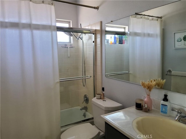 full bathroom with shower / bath combo, vanity, and toilet