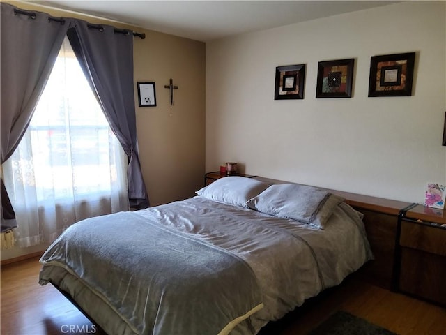 bedroom with wood-type flooring