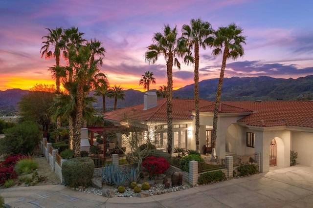 mediterranean / spanish house featuring a mountain view