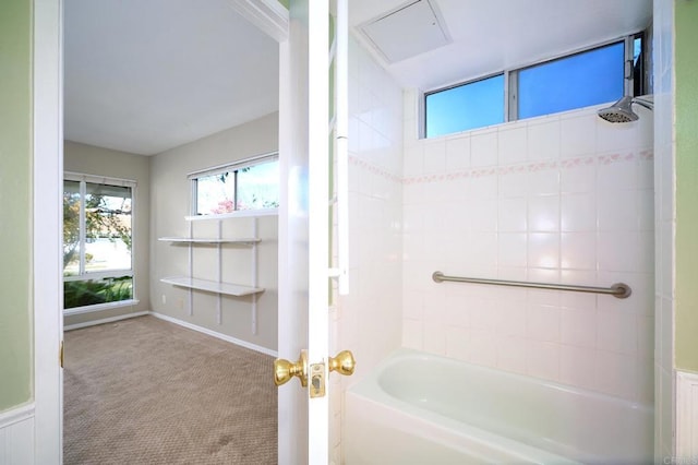 bathroom with bathing tub / shower combination