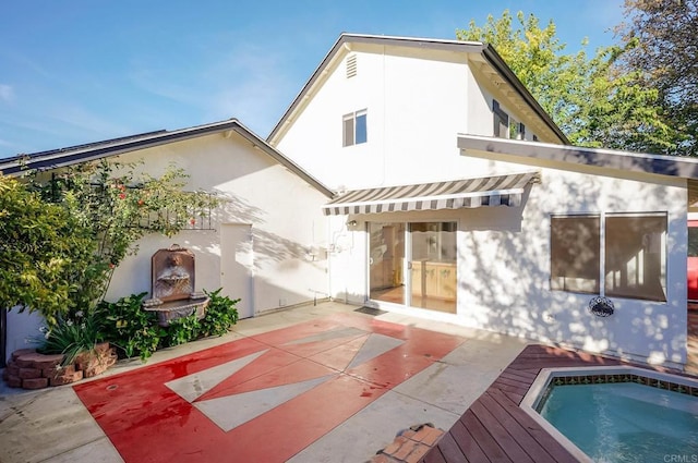 rear view of house featuring a patio