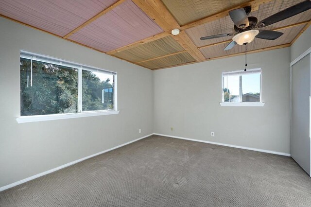 spare room featuring carpet flooring and ceiling fan