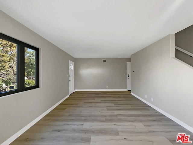 unfurnished room featuring light hardwood / wood-style flooring