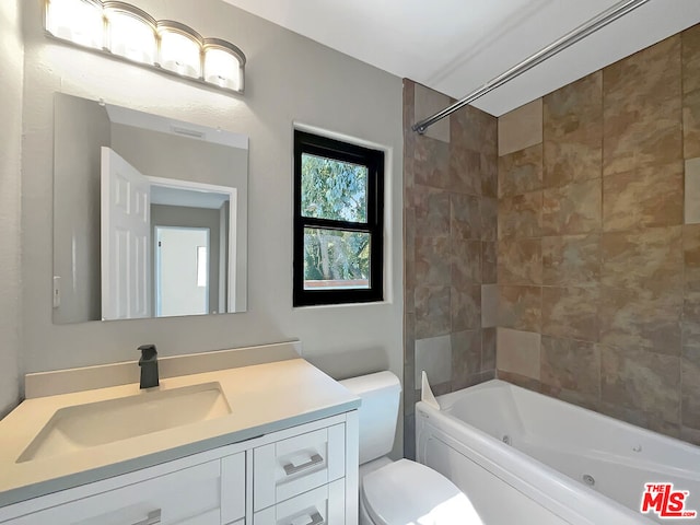 full bathroom featuring vanity, toilet, and tiled shower / bath combo