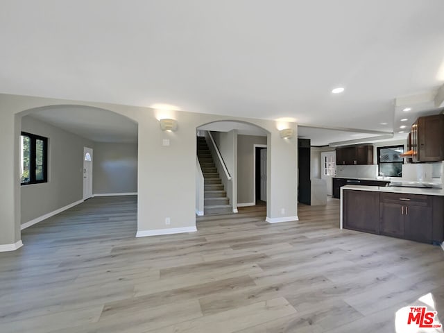 unfurnished living room featuring light hardwood / wood-style floors