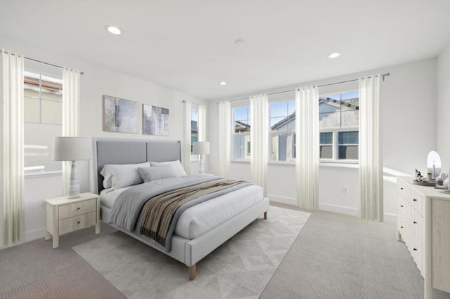 bedroom with light colored carpet