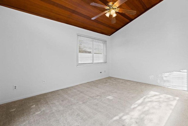 empty room with wood ceiling, ceiling fan, vaulted ceiling, and carpet