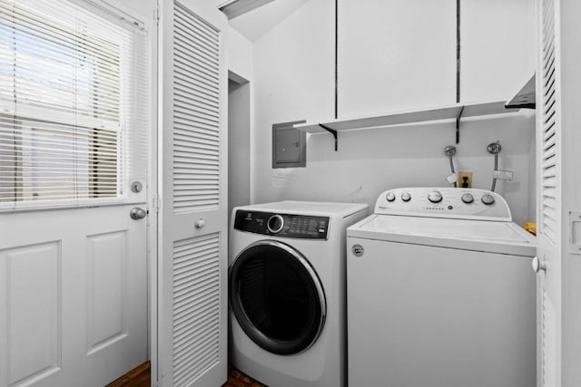 laundry room with cabinets and washer and dryer