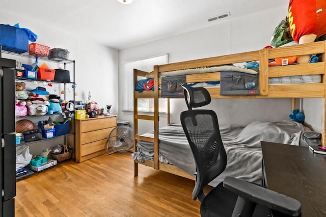 bedroom featuring wood-type flooring