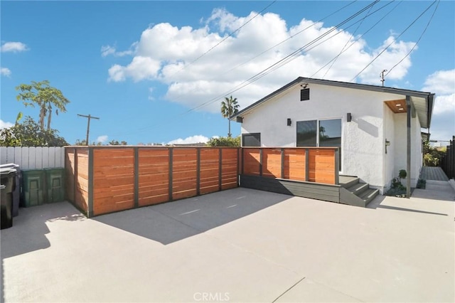 rear view of property with a patio area