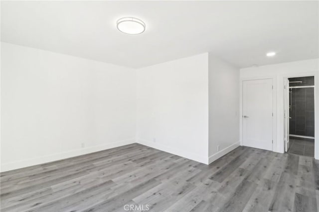 spare room with light wood-type flooring