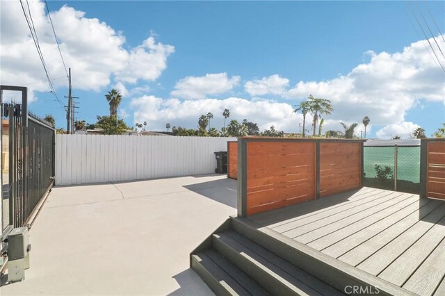 wooden terrace featuring a patio area