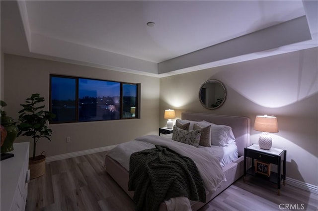 bedroom with hardwood / wood-style floors