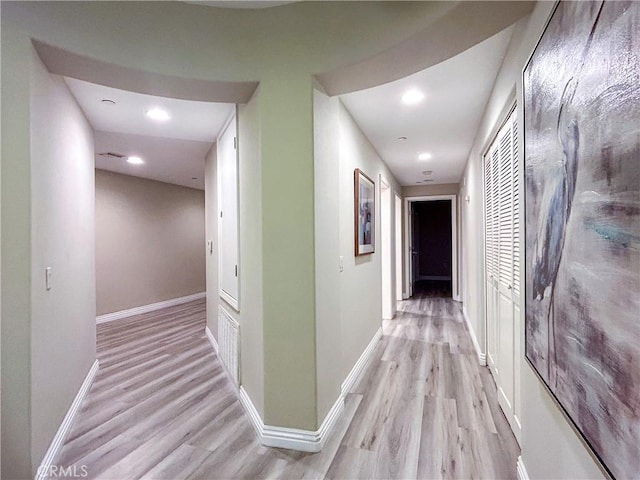 hall with light hardwood / wood-style floors